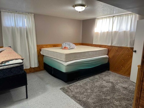 104 Chapman Avenue, Grassy Lake, AB - Indoor Photo Showing Bedroom