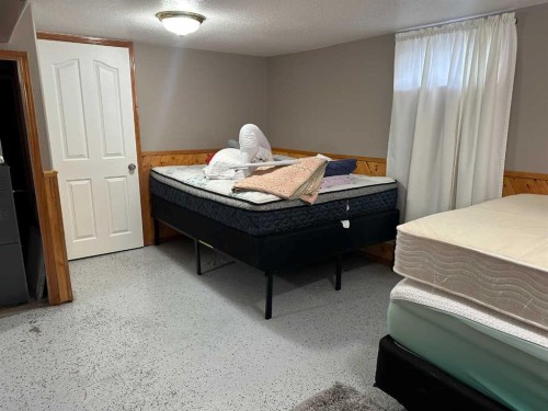 104 Chapman Avenue, Grassy Lake, AB - Indoor Photo Showing Bedroom