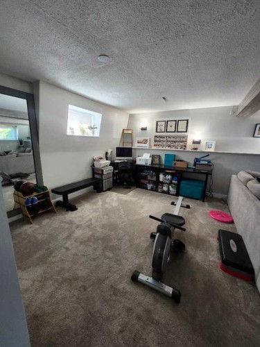 8555 Addison Place Se, Calgary, AB - Indoor Photo Showing Gym Room