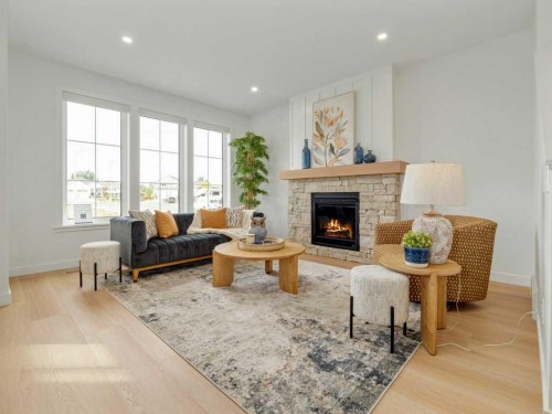 3028 21 Street, Coaldale, AB - Indoor Photo Showing Living Room With Fireplace