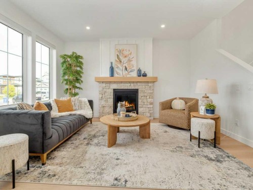 3028 21 Street, Coaldale, AB - Indoor Photo Showing Living Room With Fireplace