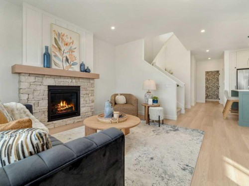 3028 21 Street, Coaldale, AB - Indoor Photo Showing Living Room With Fireplace