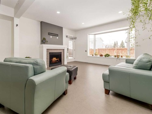 108 Gateway Mews South, Lethbridge, AB - Indoor Photo Showing Living Room With Fireplace