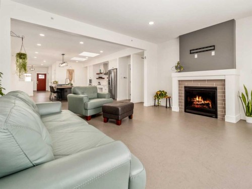 108 Gateway Mews South, Lethbridge, AB - Indoor Photo Showing Living Room With Fireplace