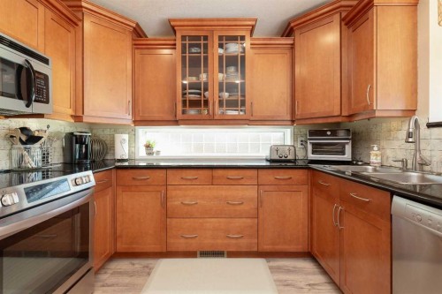 80 Canyon Boulevard West, Lethbridge, AB - Indoor Photo Showing Kitchen With Double Sink