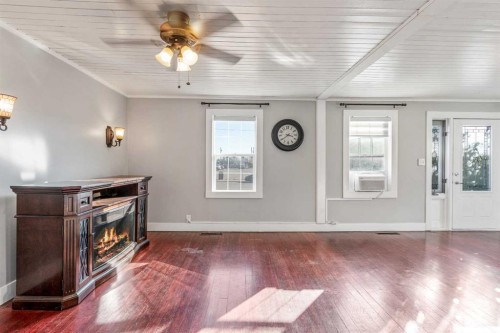 451 20 Street, Fort Macleod, AB - Indoor Photo Showing Other Room With Fireplace