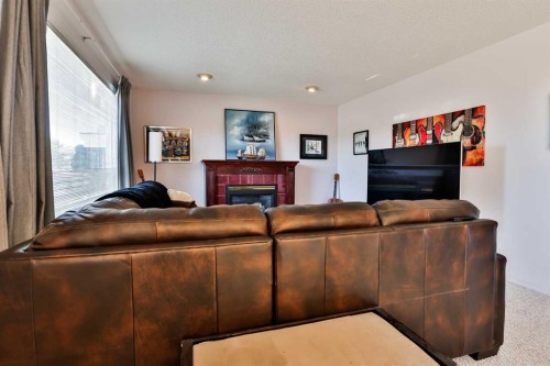 2727 7A Avenue North, Lethbridge, AB - Indoor Photo Showing Living Room With Fireplace
