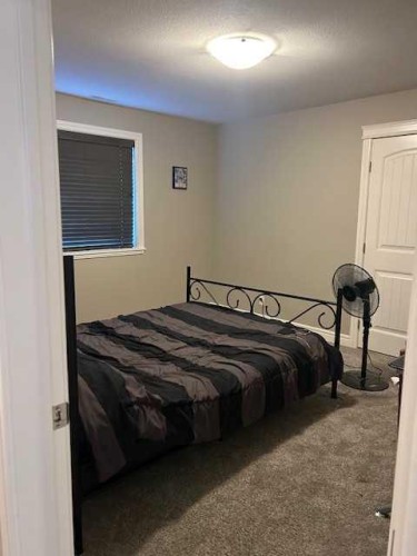 61 Westview Boulevard, Taber, AB - Indoor Photo Showing Bedroom