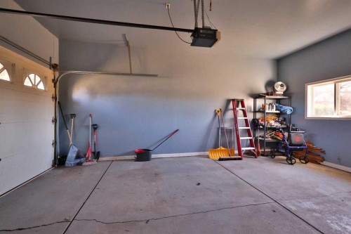 50 N 100 W, Raymond, AB - Indoor Photo Showing Garage