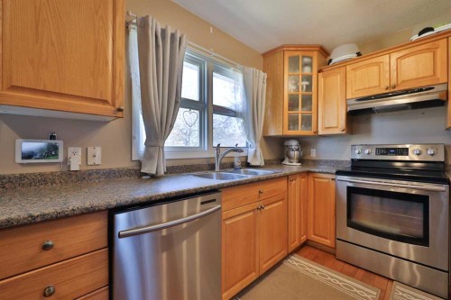 50 N 100 W, Raymond, AB - Indoor Photo Showing Kitchen With Stainless Steel Kitchen With Double Sink