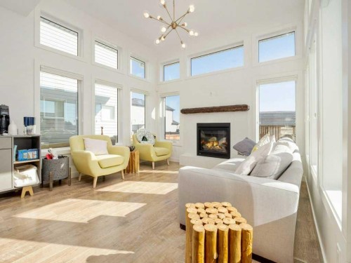 660 Aquitania Boulevard West, Lethbridge, AB - Indoor Photo Showing Living Room With Fireplace