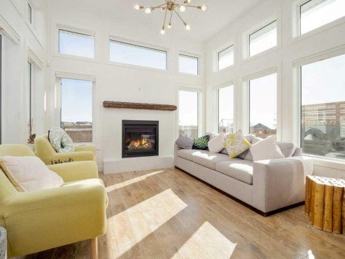 660 Aquitania Boulevard West, Lethbridge, AB - Indoor Photo Showing Living Room With Fireplace