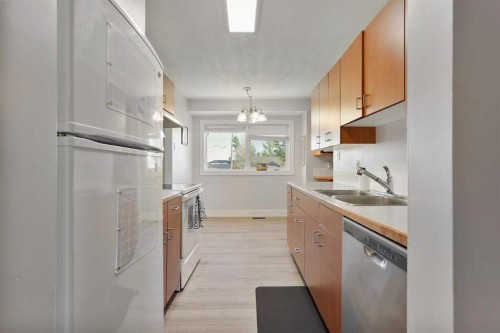 486N 100E, Raymond, AB - Indoor Photo Showing Kitchen With Double Sink