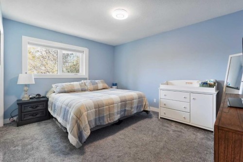 486N 100E, Raymond, AB - Indoor Photo Showing Bedroom