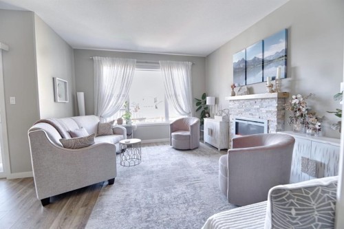1000 Atlantic Lookout West, Lethbridge, AB - Indoor Photo Showing Living Room With Fireplace
