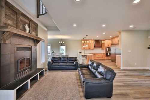 204041 Twp Rd 6-3A, Raymond, AB - Indoor Photo Showing Living Room With Fireplace