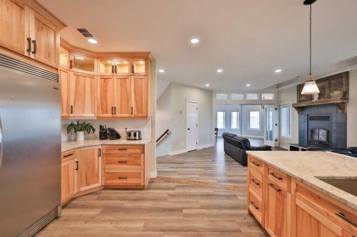 204041 Twp Rd 6-3A, Raymond, AB - Indoor Photo Showing Kitchen With Fireplace