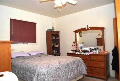 246 N 100 E, Raymond, AB - Indoor Photo Showing Bedroom