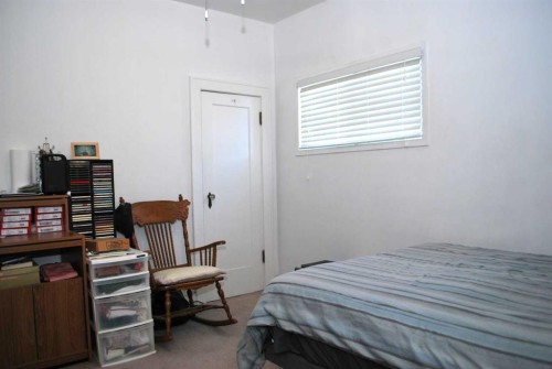 246 N 100 E, Raymond, AB - Indoor Photo Showing Bedroom