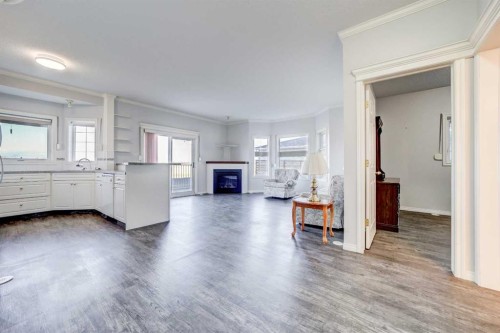 103-6 Skyline Crescent, Claresholm, AB - Indoor Photo Showing Other Room With Fireplace