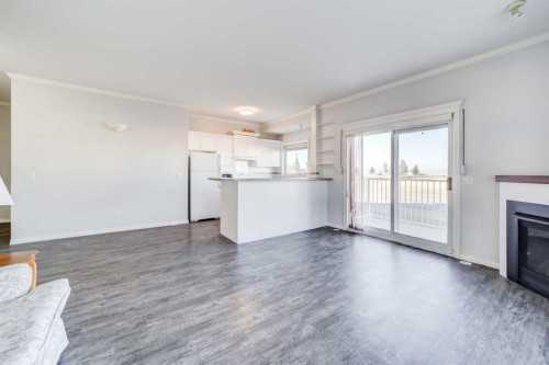 103-6 Skyline Crescent, Claresholm, AB - Indoor With Fireplace