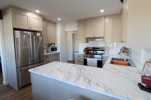 5707 50 St, Taber, AB - Indoor Photo Showing Kitchen With Double Sink