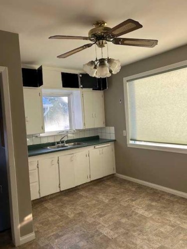 4817 51 Avenue, Taber, AB - Indoor Photo Showing Kitchen With Double Sink