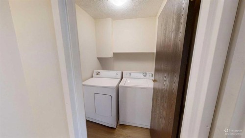 304-401 Columbia Boulevard West, Lethbridge, AB - Indoor Photo Showing Laundry Room