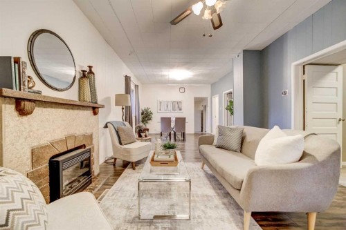 433 17 Street, Fort Macleod, AB - Indoor Photo Showing Living Room With Fireplace