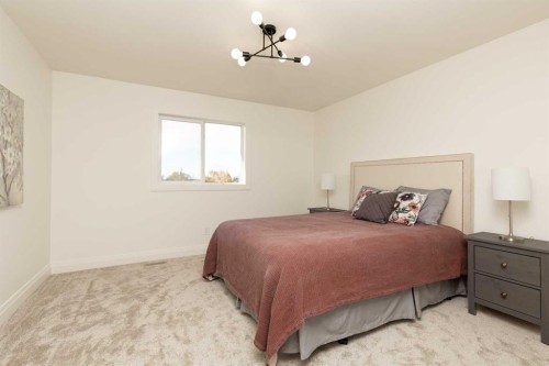 304 S 50 W, Raymond, AB - Indoor Photo Showing Bedroom