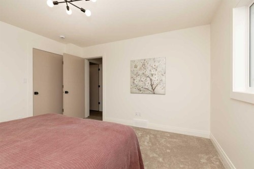 310 S 50 W, Raymond, AB - Indoor Photo Showing Bedroom