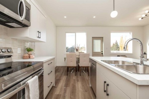 310 S 50 W, Raymond, AB - Indoor Photo Showing Kitchen With Double Sink With Upgraded Kitchen