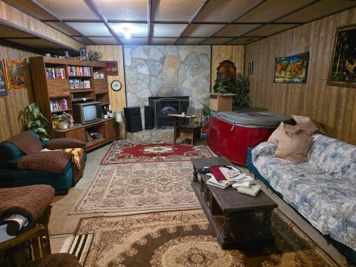 275083 Twp Rd 41, Hill Spring, AB - Indoor With Fireplace