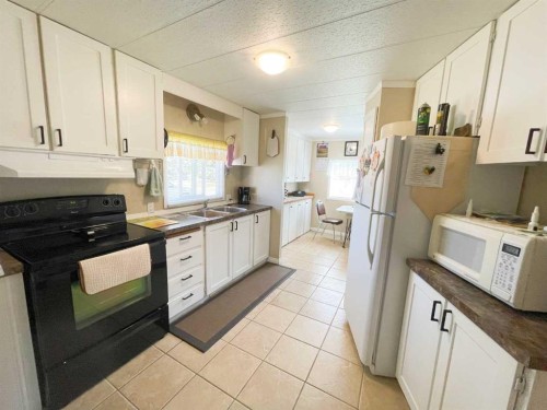 331 Armstrong Street, Carmangay, AB - Indoor Photo Showing Kitchen With Double Sink