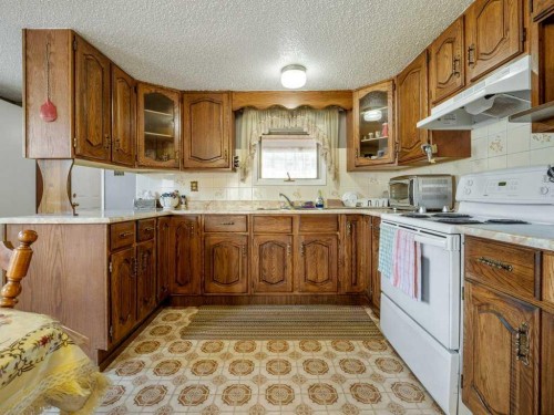 8109 16 Avenue, Coleman, AB - Indoor Photo Showing Kitchen With Double Sink
