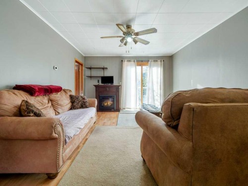 8109 16 Avenue, Coleman, AB - Indoor Photo Showing Living Room With Fireplace