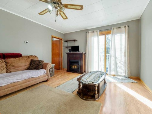8109 16 Avenue, Coleman, AB - Indoor Photo Showing Living Room With Fireplace