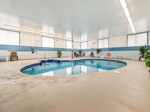 302-65 Temple Boulevard West, Lethbridge, AB - Indoor Photo Showing Other Room With In Ground Pool