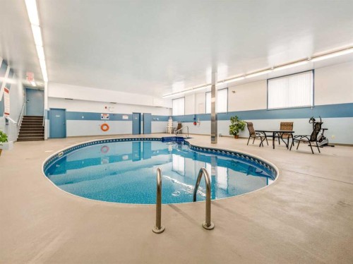 302-65 Temple Boulevard West, Lethbridge, AB - Indoor Photo Showing Other Room With In Ground Pool