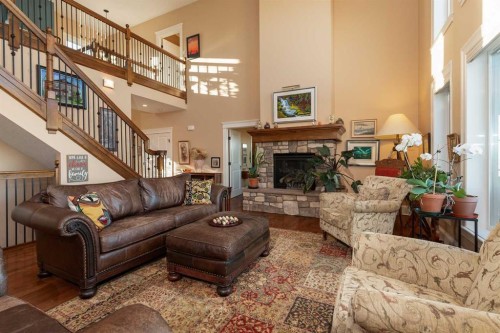 124 Canyoncrest Point West, Lethbridge, AB - Indoor Photo Showing Living Room With Fireplace