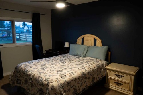 230 E 100 S Street, Raymond, AB - Indoor Photo Showing Bedroom