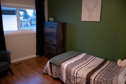 230 E 100 S Street, Raymond, AB - Indoor Photo Showing Bedroom