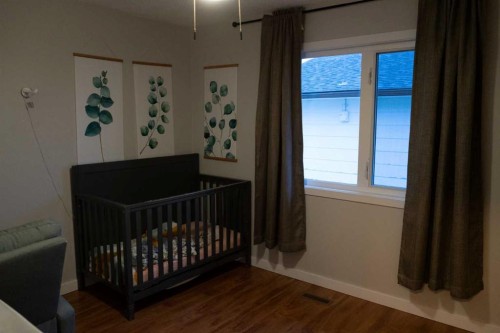 230 E 100 S Street, Raymond, AB - Indoor Photo Showing Bedroom