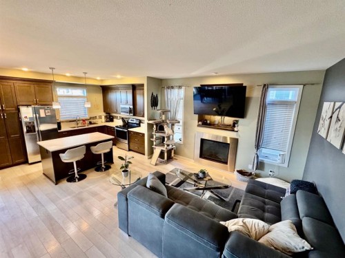 266 Lynx Road North, Lethbridge, AB - Indoor Photo Showing Living Room With Fireplace