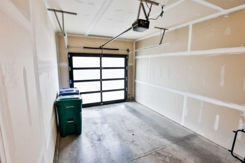 4-73 Aquitania Circle West, Lethbridge, AB - Indoor Photo Showing Garage