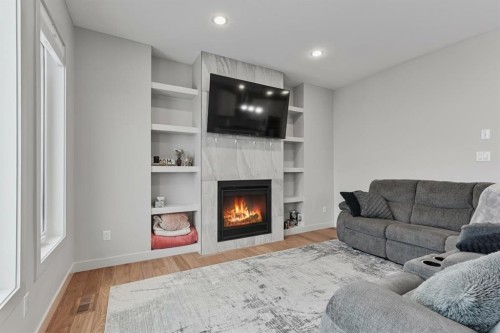806 Miners Boulevard West, Lethbridge, AB - Indoor Photo Showing Living Room With Fireplace