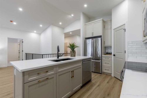 112 E 300 S, Raymond, AB - Indoor Photo Showing Kitchen With Stainless Steel Kitchen With Double Sink With Upgraded Kitchen