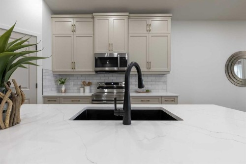 112 E 300 S, Raymond, AB - Indoor Photo Showing Kitchen With Double Sink