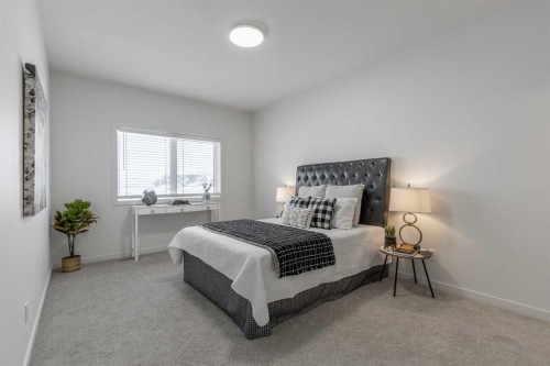 112 E 300 S, Raymond, AB - Indoor Photo Showing Bedroom