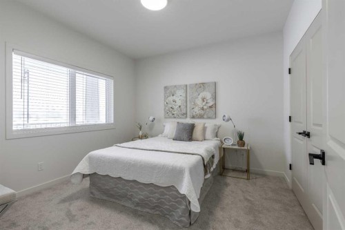 112 E 300 S, Raymond, AB - Indoor Photo Showing Bedroom